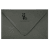 A gray envelope with a black logo on it.