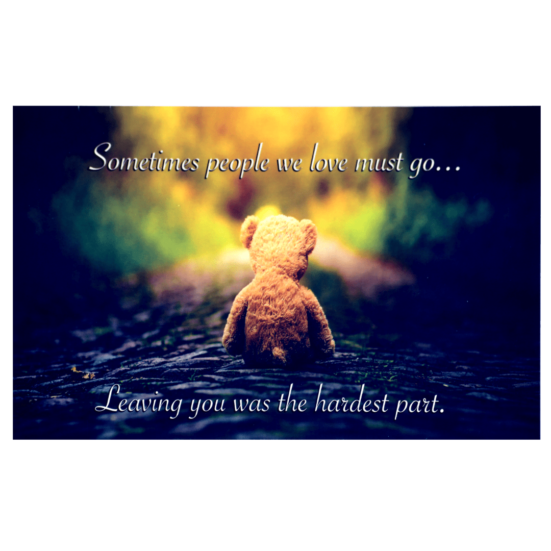 A teddy bear sitting on the ground with a quote.