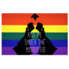 A rainbow flag with two silhouettes of people in the background.