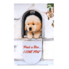 A dog sitting in the window of a house.