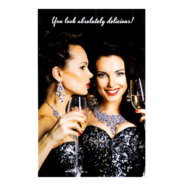 Two women holding wine glasses and one is wearing a necklace.