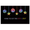 A black background with colorful lights hanging from it.