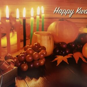 A table with candles and fruits on it.