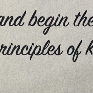 A close up of the words and begin the principles of karma