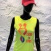A neon yellow tank top with the words " love is love ".