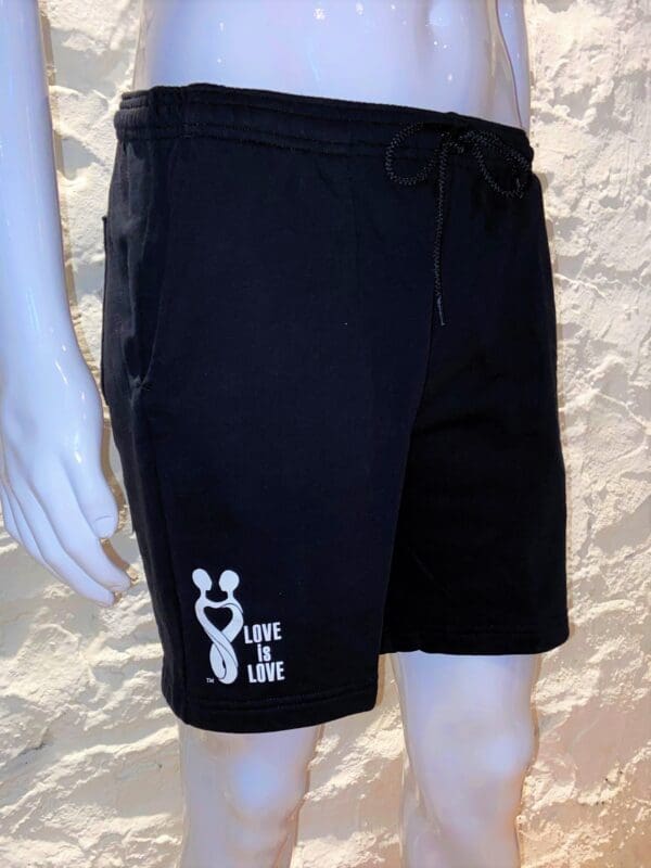 A black shorts with a white logo on it