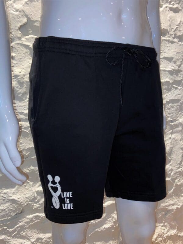 A black shorts with a white logo on it