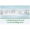 A card with trees and snow in the background.