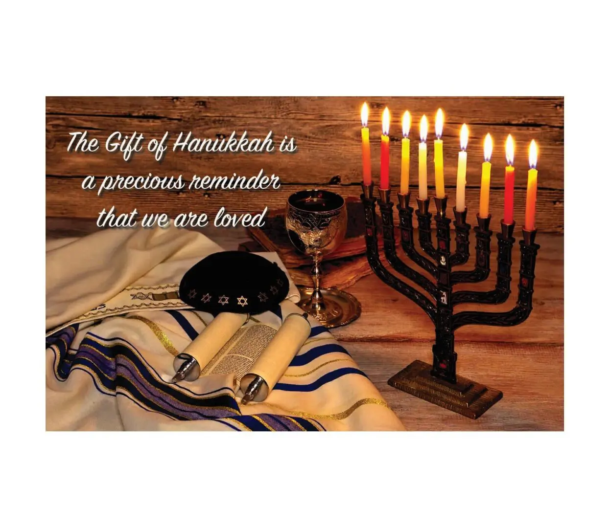 A picture of the candle lit menorah with a glass and wine.