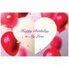 A birthday card with balloons and confetti