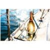 A bottle of wine and two glasses on the deck of a boat.