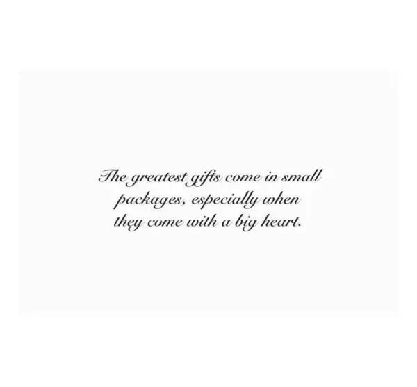 A card with the words " the greatest gift comes in small packages, especially when they come with a key heart ".