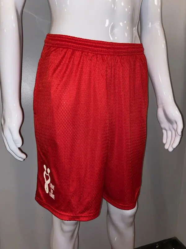 A red shorts with white letters on it