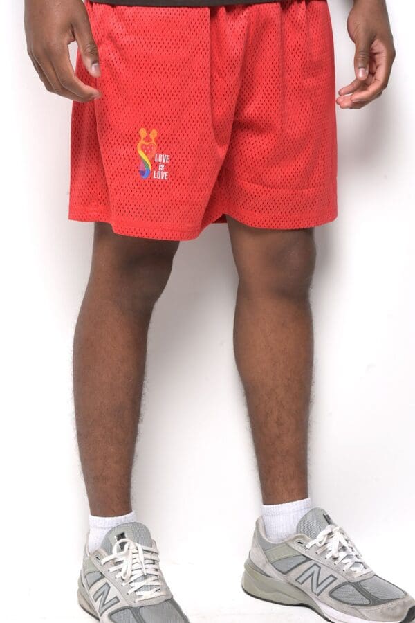 A person wearing red shorts and white socks.