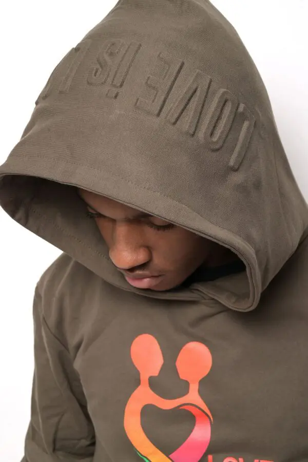 A man wearing a hoodie with an orange logo on it.