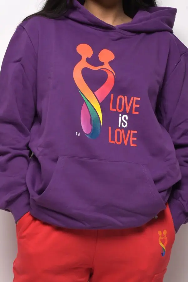 A purple sweatshirt with the words " love is love ".