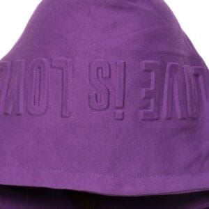 A purple hooded towel with the word 