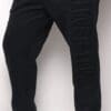A person wearing black pants and shoes