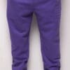 A purple pair of pants hanging on the wall.