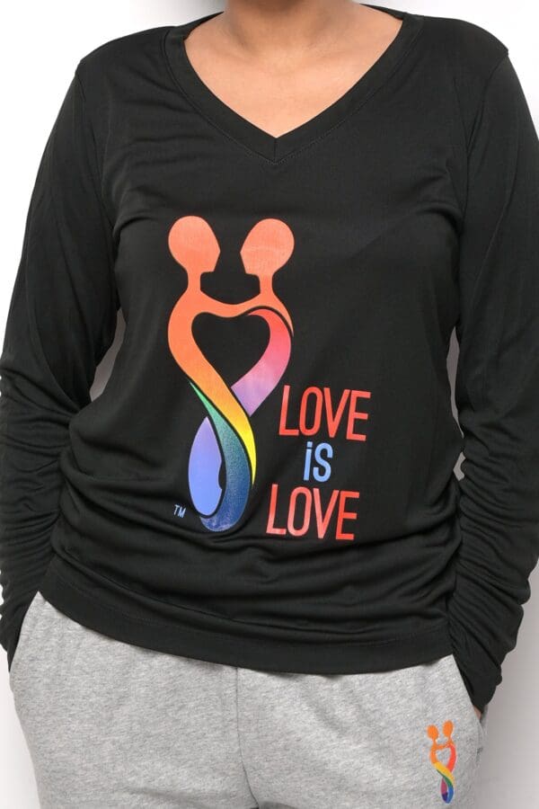 A woman wearing a black shirt with the words " love is love ".