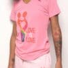 A woman wearing pink shorts and a t-shirt.