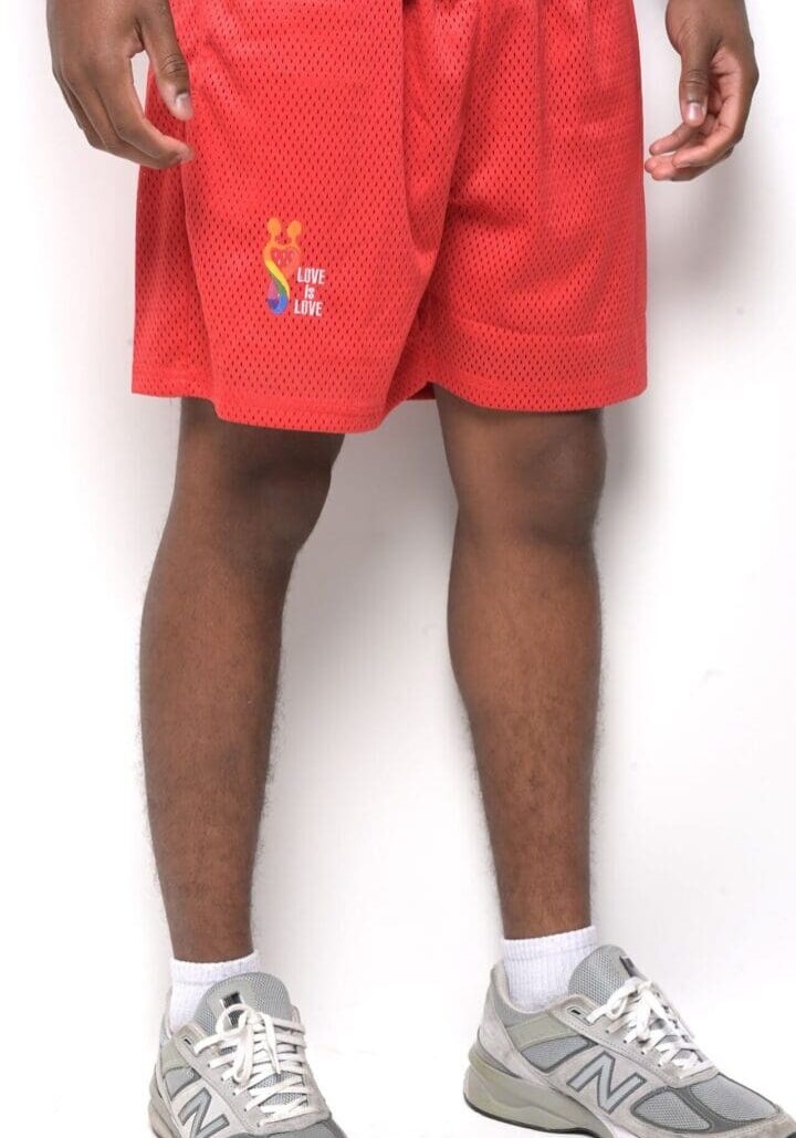 A person wearing red shorts and white socks.